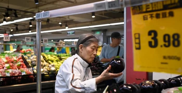 【名家专栏】中国经济面临双重打击